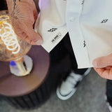 ESSENTIAL BAD LUCK SUCKS WHITE BUTTON UP