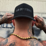 BAD INFLUENCE BLACK ON BLACK FLEXFIT COTTON HAT