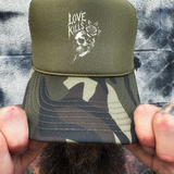 LOVE KILLS FOAM CURVED BILL GREEN CAMO HAT