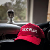 UNBOTHERED CURVED BILL RED HAT