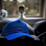 UNBOTHERED CURVED BILL BLUE HAT