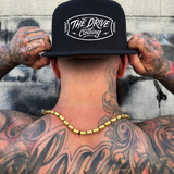 BADGE FLAT BILL HAT